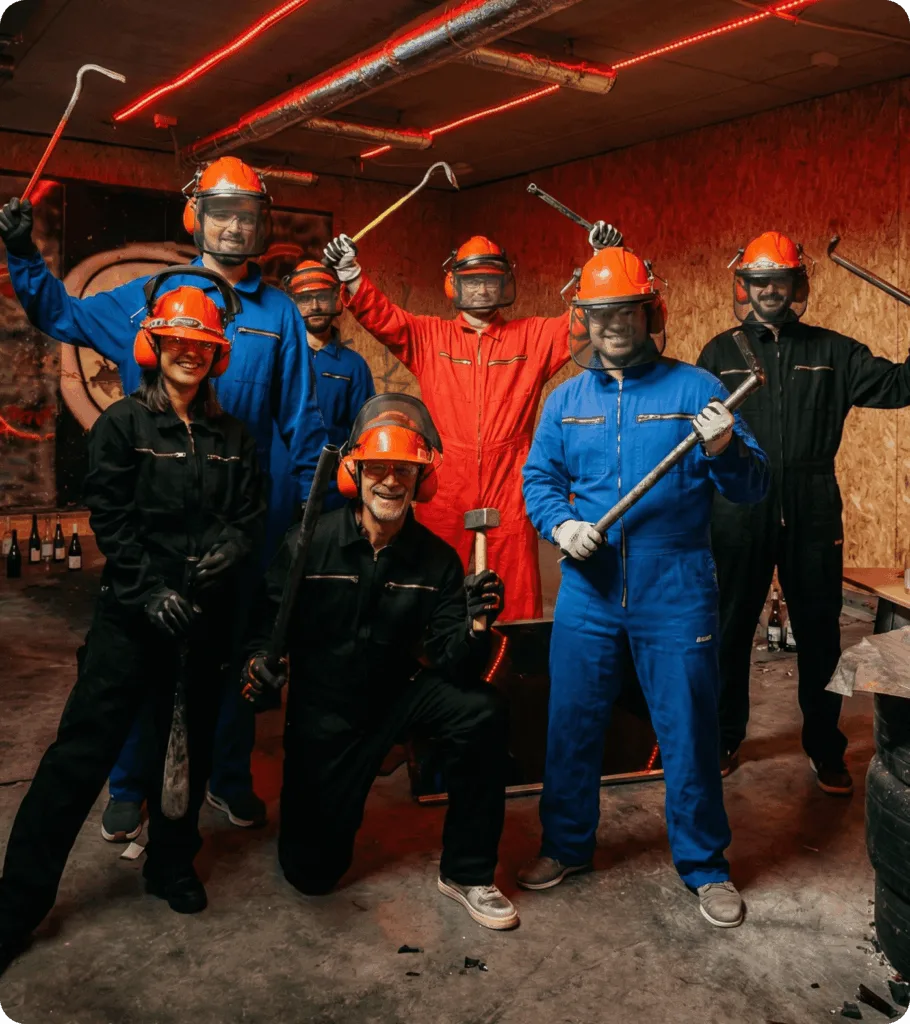 Group of friends enjoying a smash session at The Rage Room Genk, fun for everyone